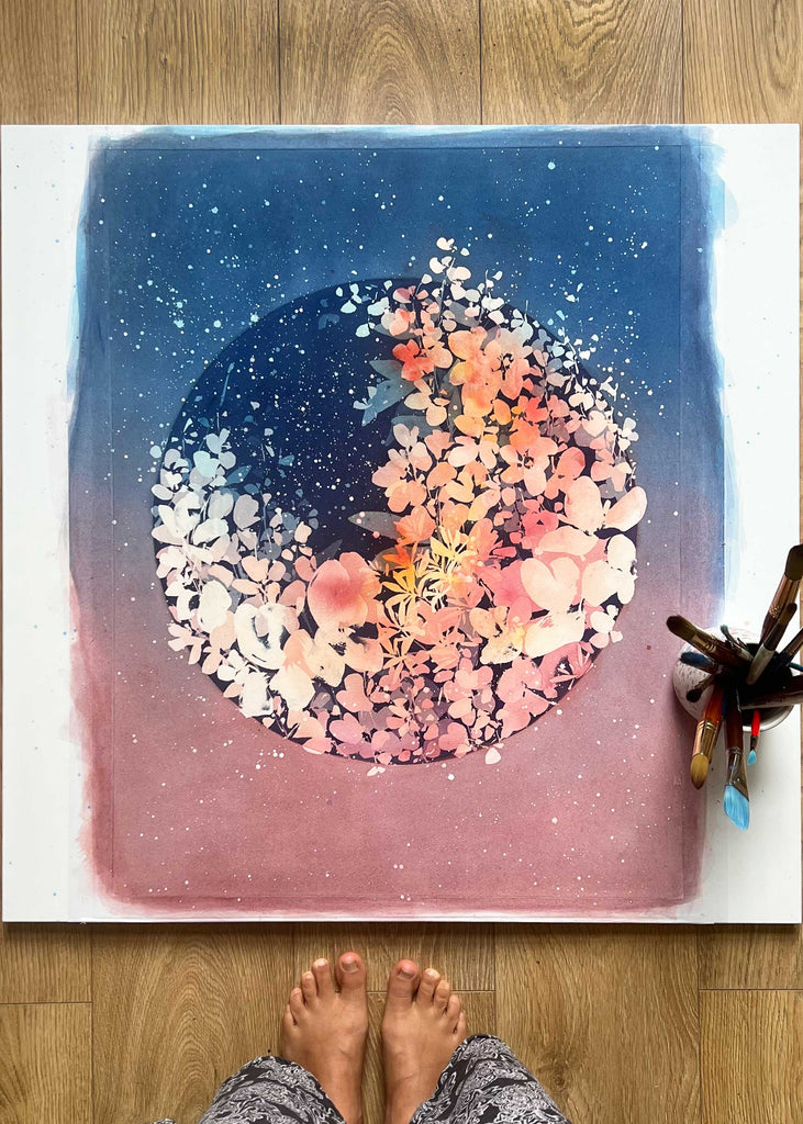 Floral Moonrise invites you to contemplate the delicate dance between nature's blooms and the celestial rhythms above, celebrating the inherent grace in life's continual transformations. Art by Ingrid Sanchez.