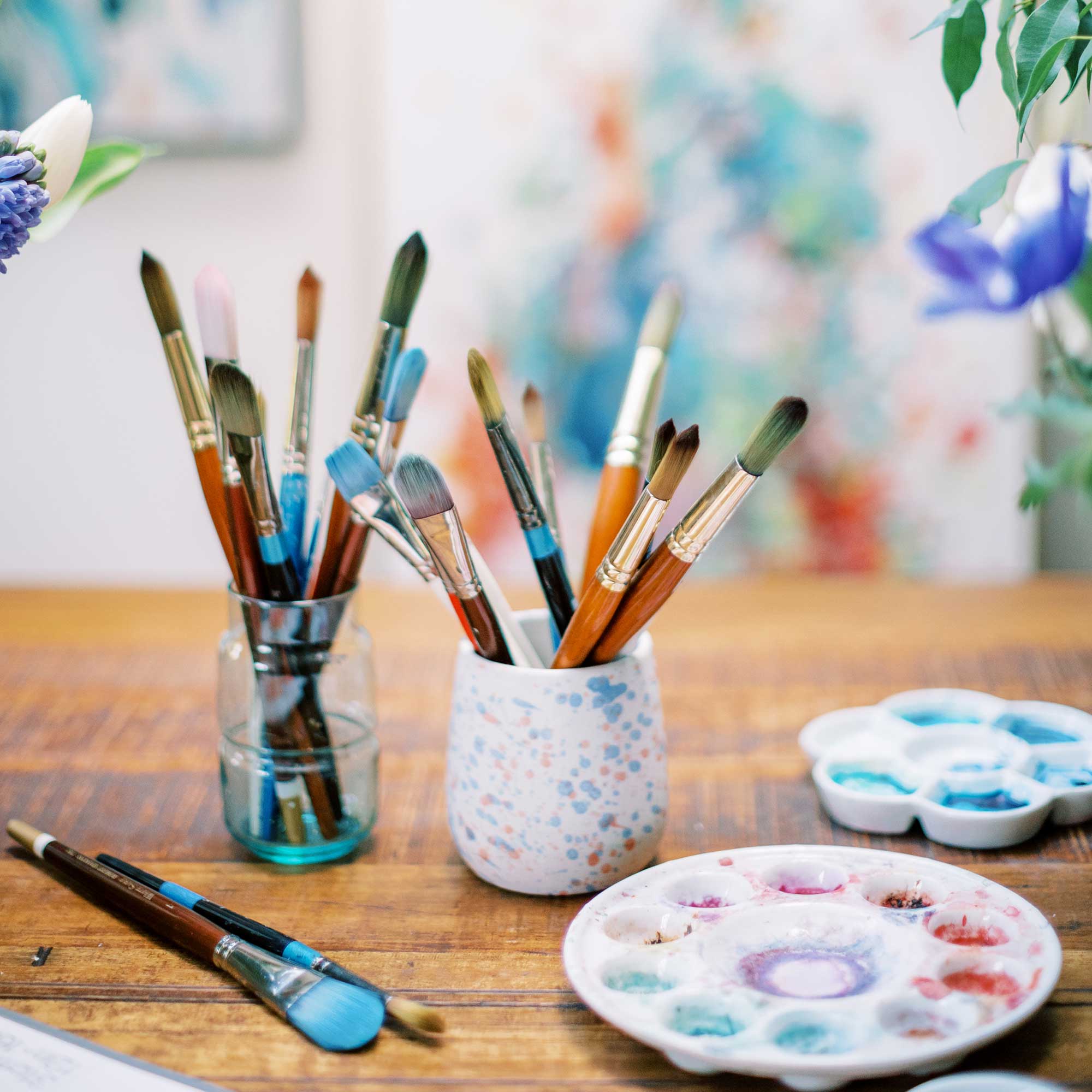 Brushes and watercolor palettes. Art studio, London.