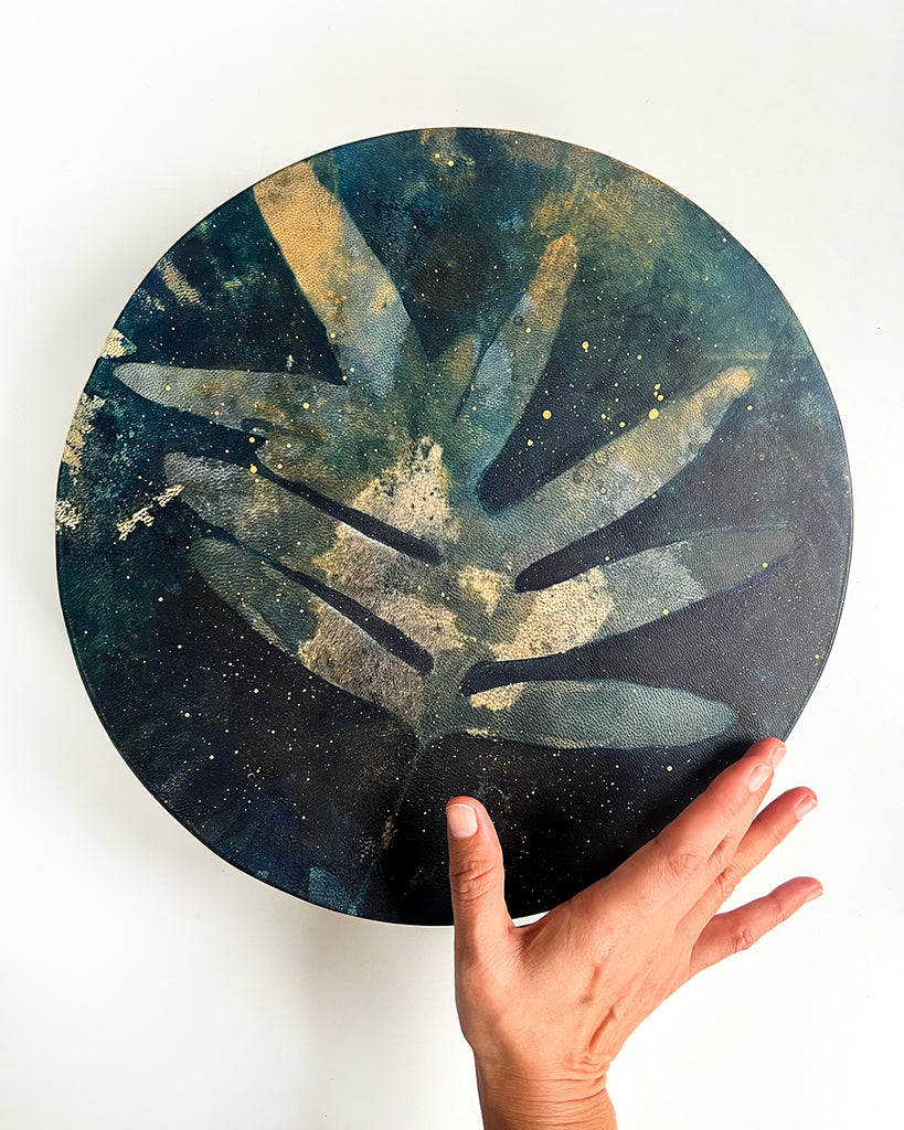 12-inch shamanic drum with blue cyanotype fern print and gold star details by artist Ingrid Sanchez.