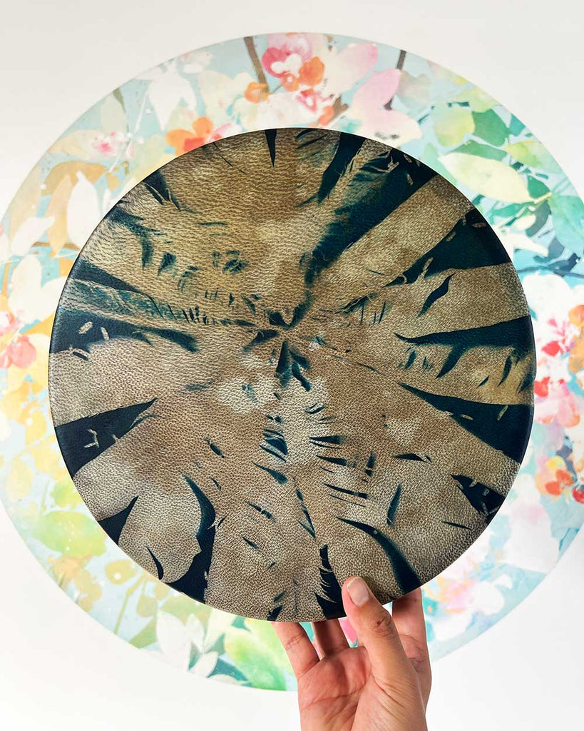 Feather Spirit shamanic drum with deep blue dyed hide and natural feather silhouettes created using cyanotype, by artist Ingrid Sanchez, London, UK.