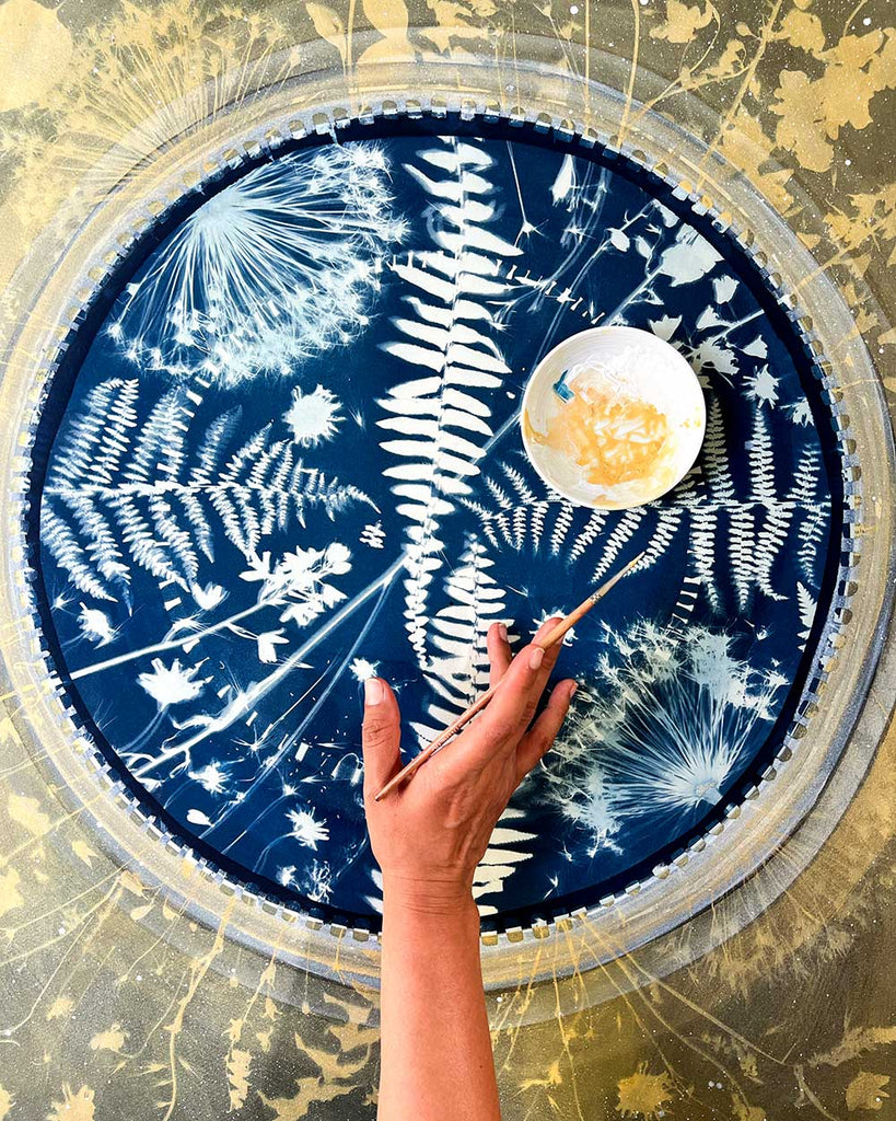 Front view of ‘Fern-Moon-Spirit’ original watercolor and cyanotype painting by Ingrid Sanchez, featuring a moon design with ferns and garden plants.