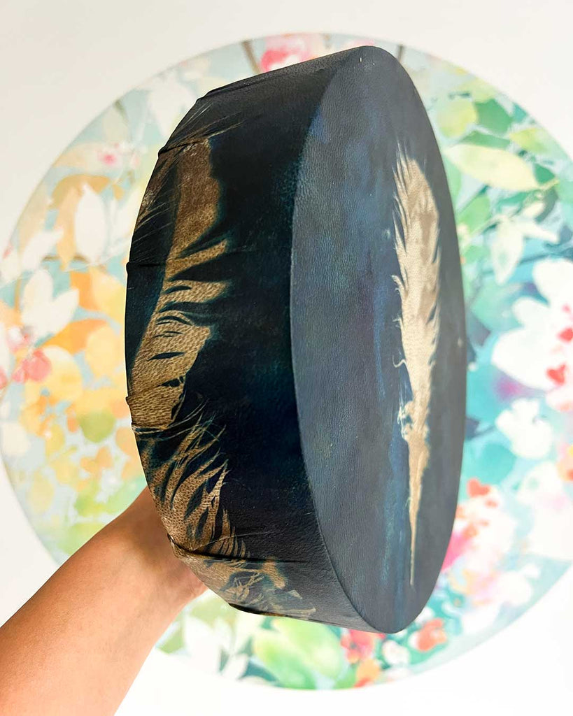 Side of Dreamfeather 10-inch shamanic drum showing cyanotype feather textures.