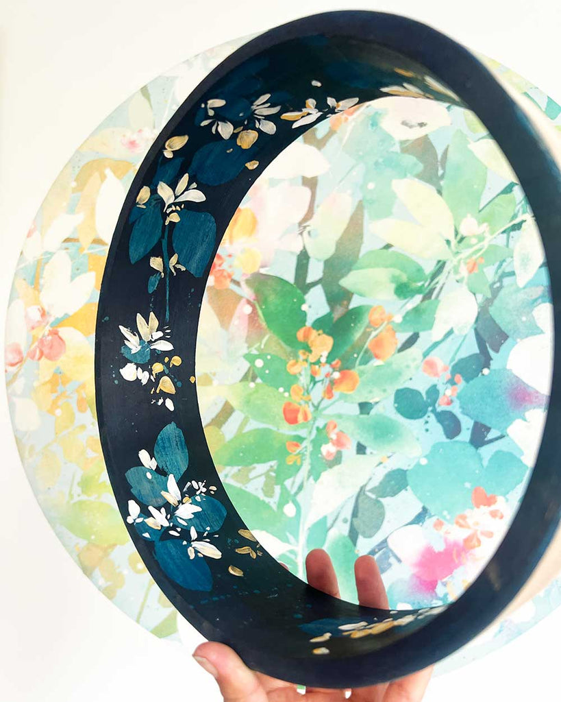 Close-up of hand-painted honeysuckle flowers on cyanotype goat hide of 10-inch shamanic drum.