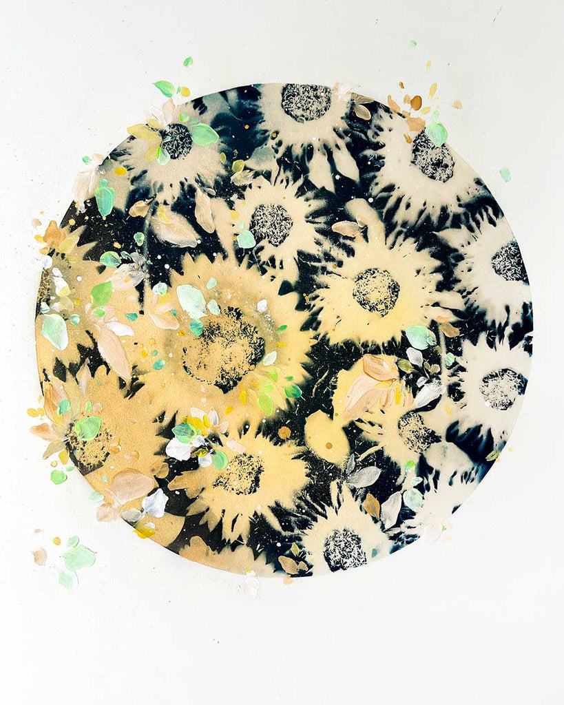 Botanical moon artwork featuring green and yellow flower shapes