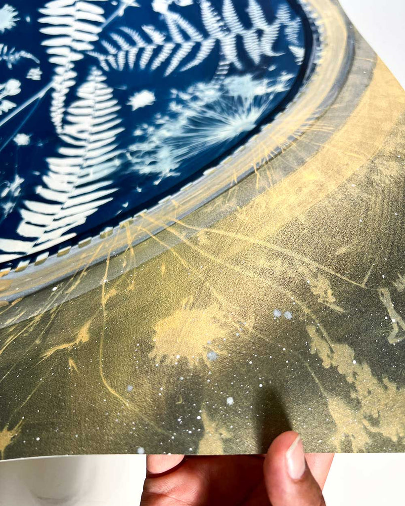 Close-up detail of ‘Fern-Moon-Spirit’ artwork, showing cyanotype fern patterns layered with watercolor textures in earthy greens, deep indigos and gold.