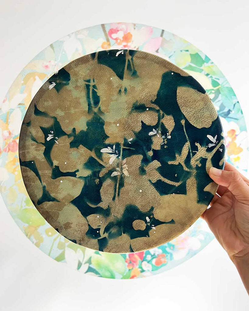 Honeysuckle Dream Spirit 10-inch shamanic drum, deep blue cyanotype hide with hand-painted white and cream honeysuckle flowers by artist Ingrid Sanchez.