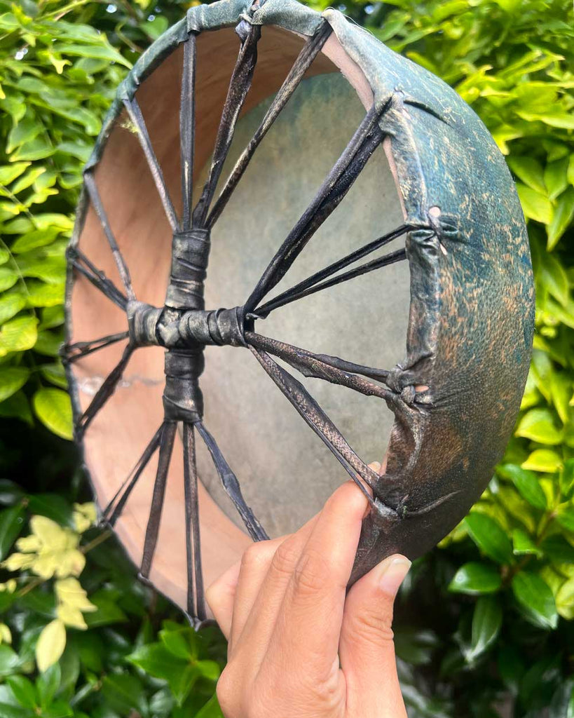 Natural mulberry wood hoop of the A Small Wish drum, highlighting its raw handcrafted finish.