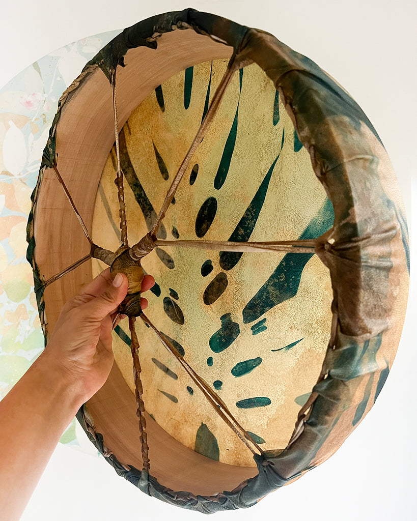 Handmade cedar hoop drum showing back lacing with a single braid symbolising grandmotherly wisdom.