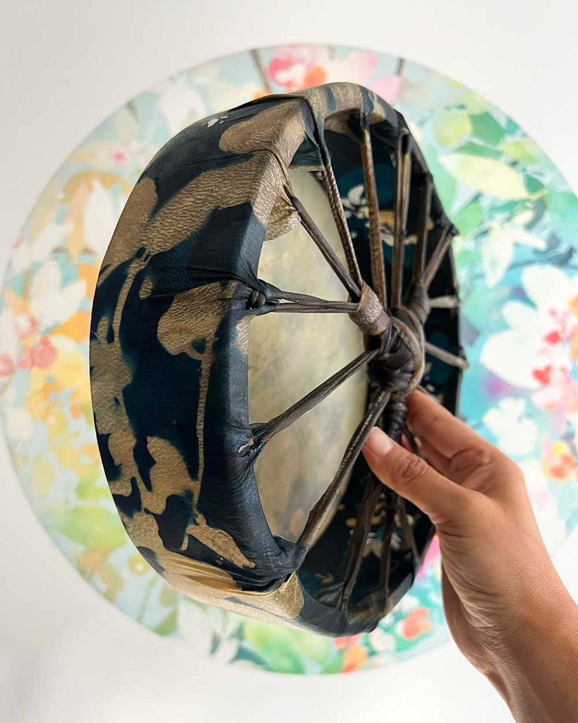 Artisan-made shamanic drum, deep midnight blue hide with hand-painted honeysuckle blooms.