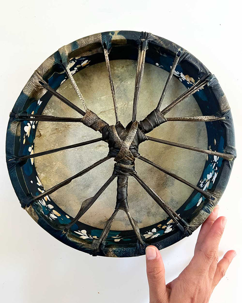 Honeysuckle Dream Spirit drum by Ingrid Sanchez, highlighting hand-painted floral details and woven natural hide handle.
