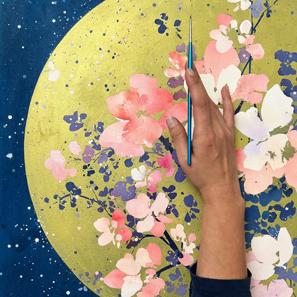 Painting of a golden sun with beautiful soft pink flowers, surrounded by a dark blue sky, purple leaves, blue branches, and a starry night sky. Original art by Ingrid Sanchez.