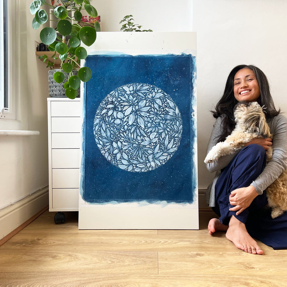 Watercolor artist Ingrid Sanchez, AKA CreativeIngrid with 'Full Snow Moon' and her Shih Tzu 'Ernie'. London, 2022.