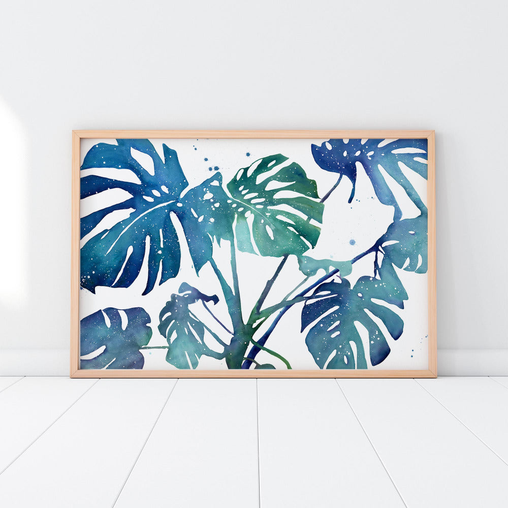 Wall art of a blue monstera plant in shades of blue, turquoise and green. Watercolor art prints by CreativeIngrid, Ingrid Sanchez.