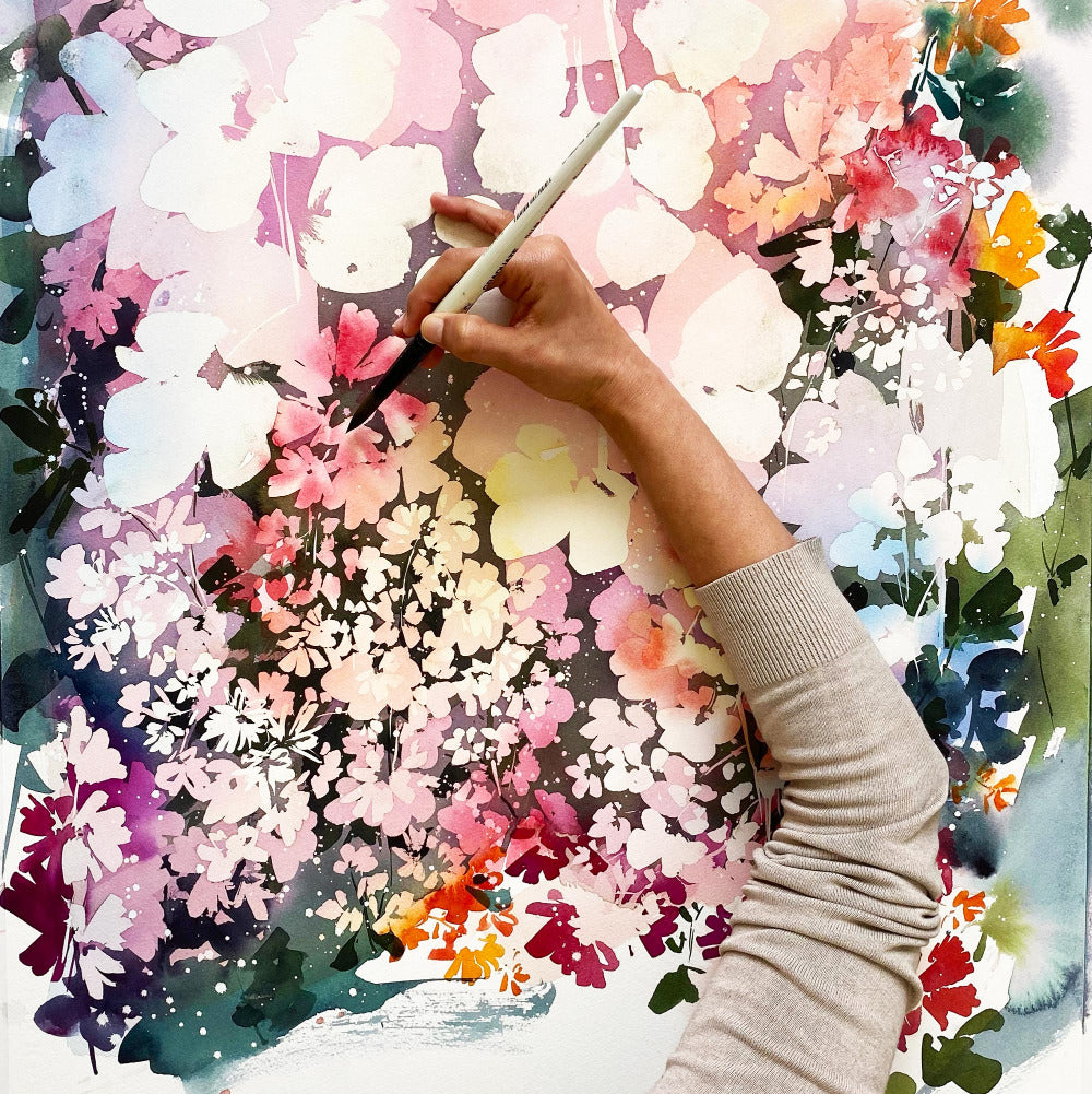 Masking fluid with watercolors. Modern botanical and flower watercolor. Process painting by Ingrid Sanchez, AKA CreativeIngrid in her workshop art studio in London. 'Pink Dusk Garden', 2021.